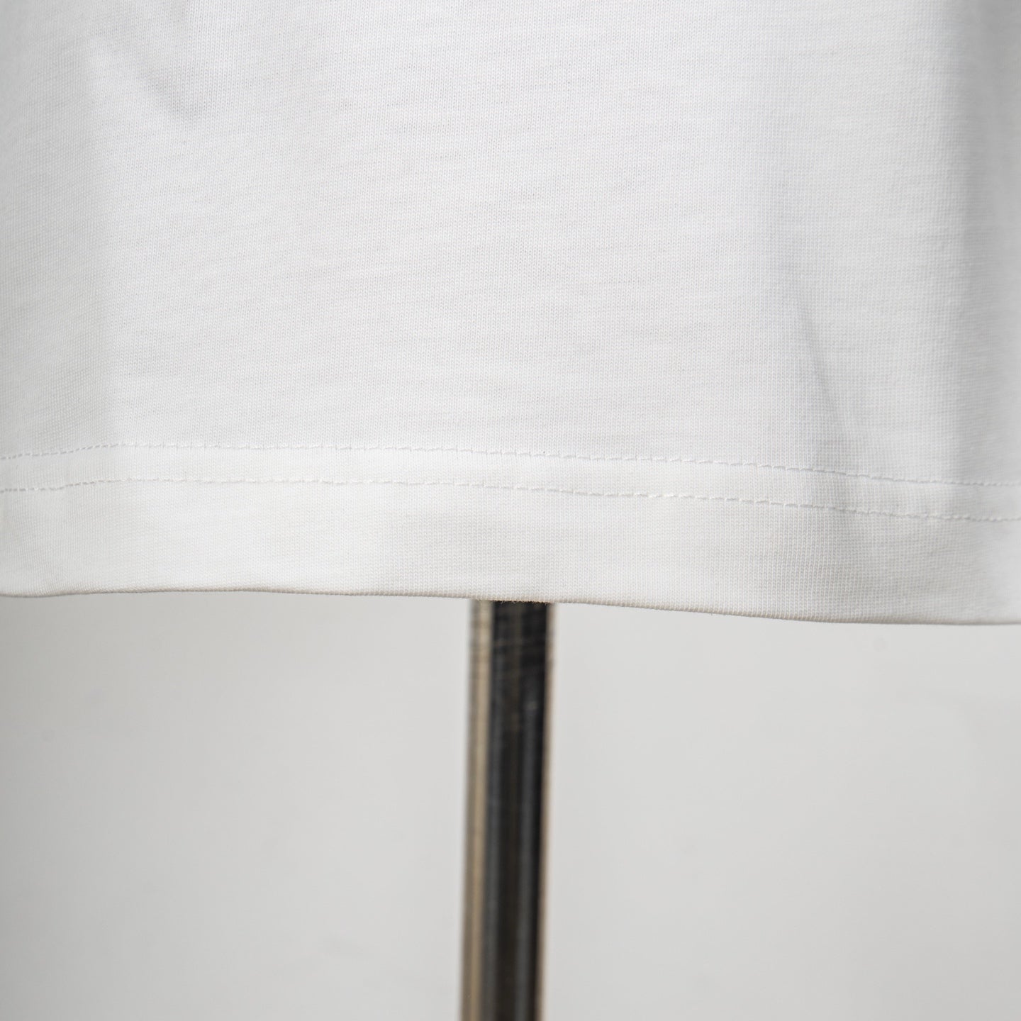 White Dior T-shirt hem stitching detail