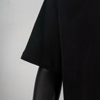 Black T-shirt sleeve and hem stitching detail