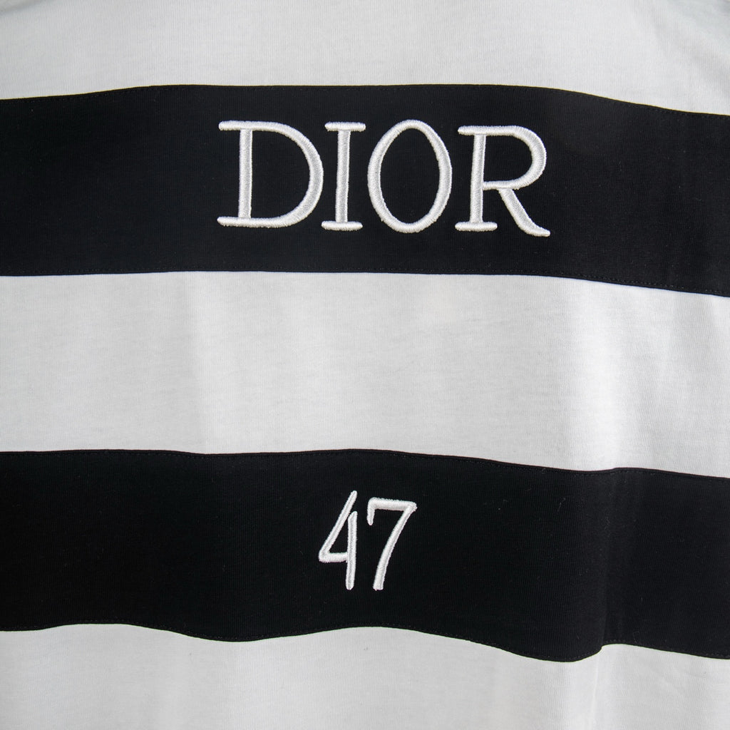 White T-shirt with "DIOR" text and dark stripe band