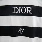White T-shirt with "DIOR" text and dark stripe band
