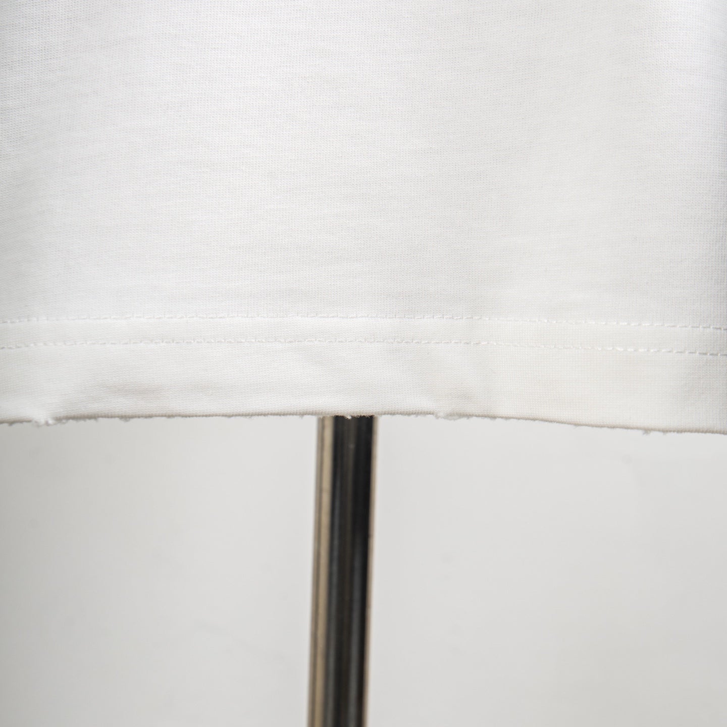 White T-shirt with stitched hem detail