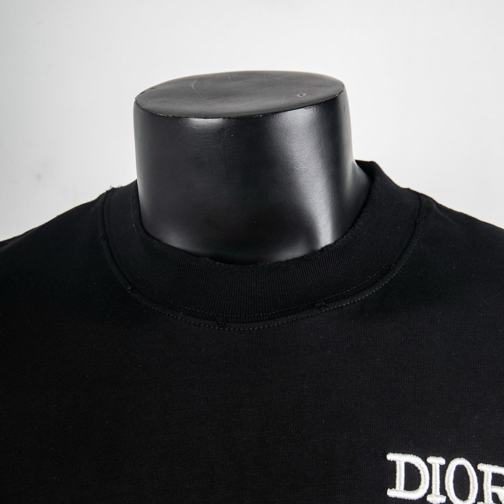 Black short-sleeve T-shirt with neckline detail and partial DIOR logo