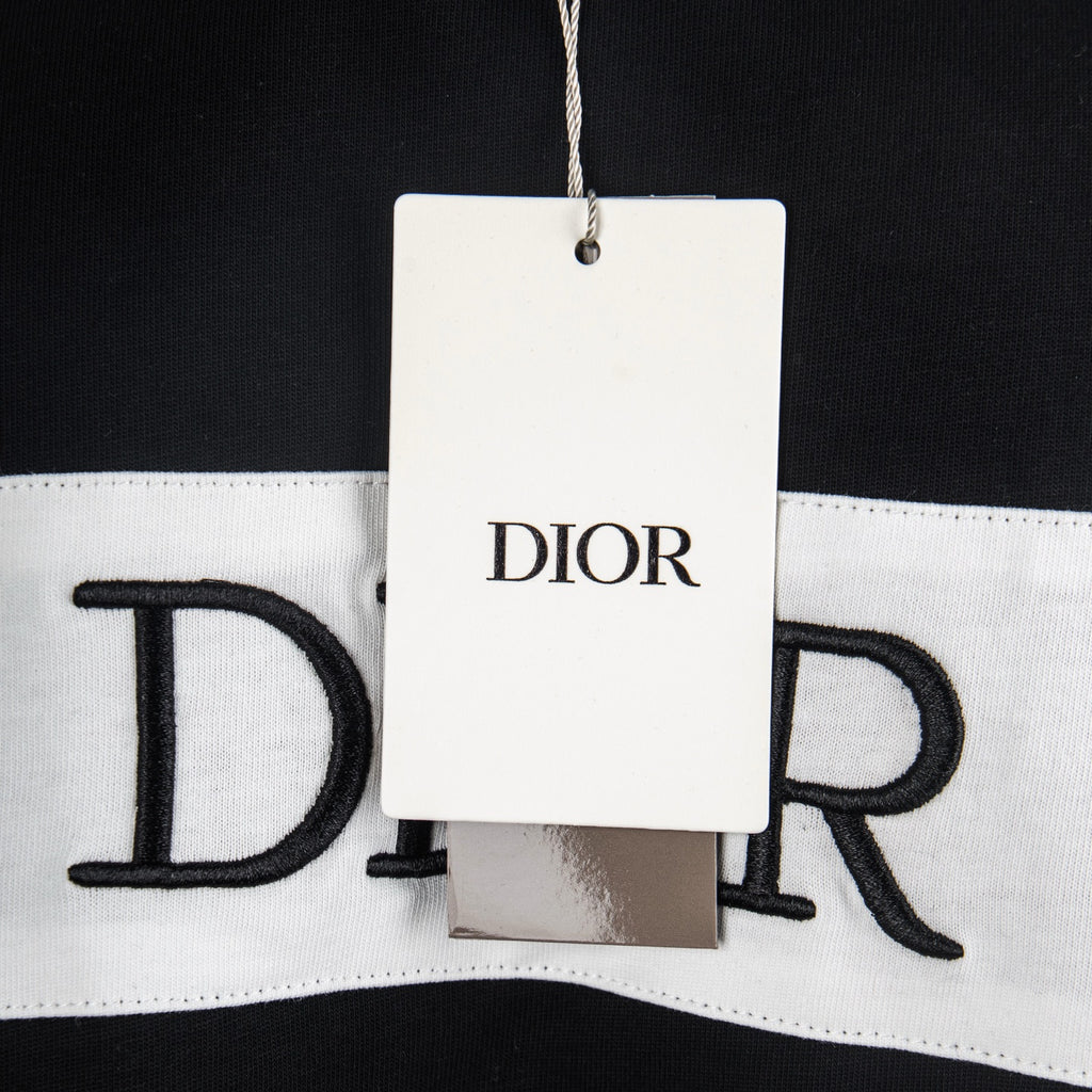 Black T-shirt with white hem panel and DIOR tag