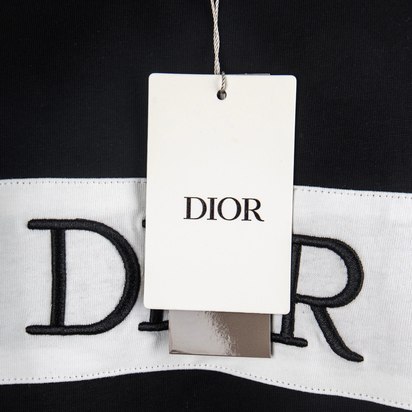 Black-and-white T-shirt with DIOR tag on neckline