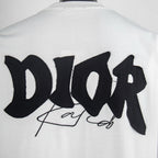 Close-up of large black back logo graphic on white crewneck T-shirt