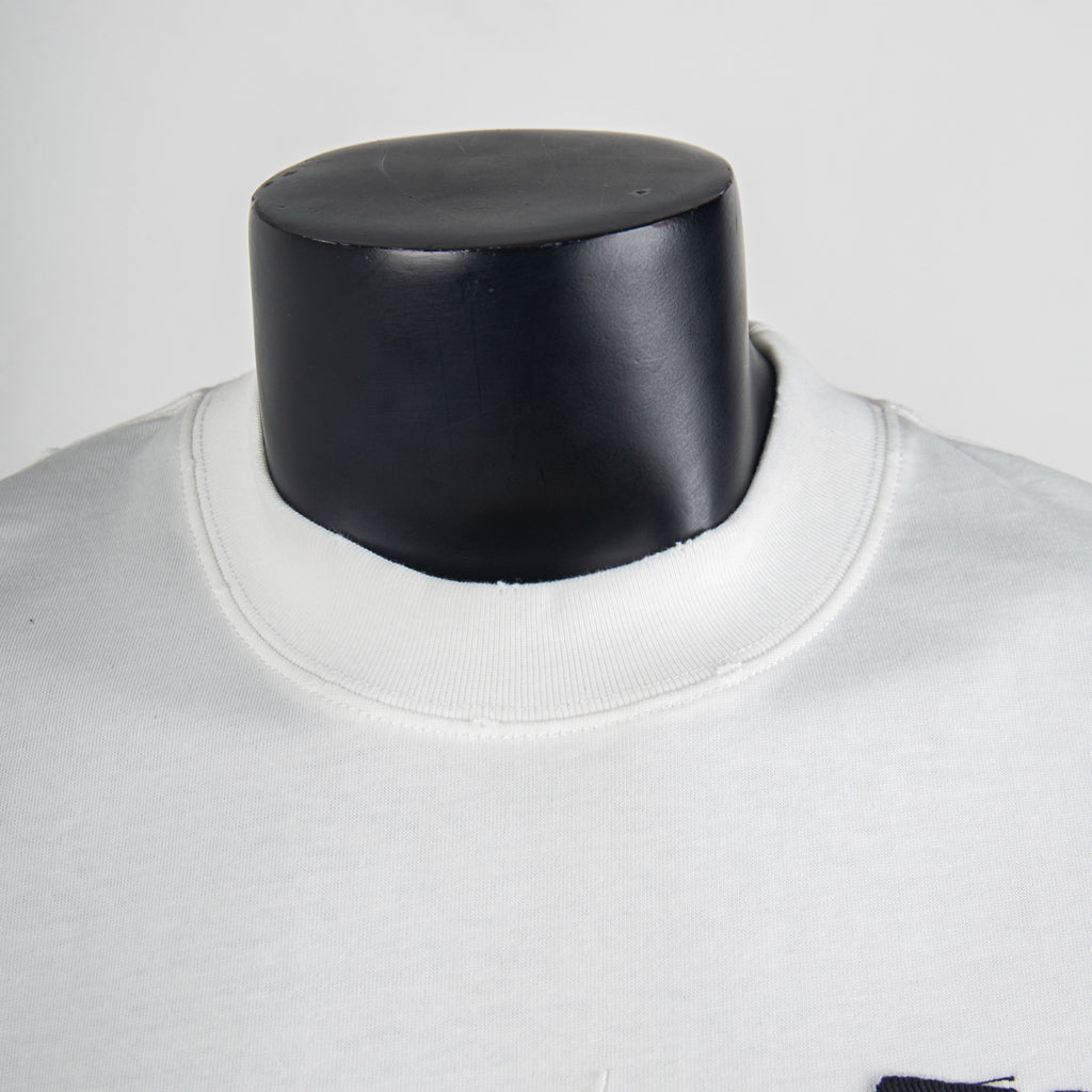White crewneck T-shirt neckline with visible ribbed collar seam