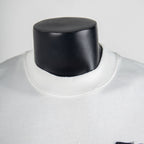 White crewneck T-shirt neckline with visible ribbed collar seam