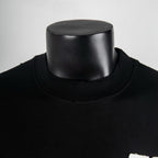 Black mock-neck T-shirt with ribbed collar and smooth jersey neckline
