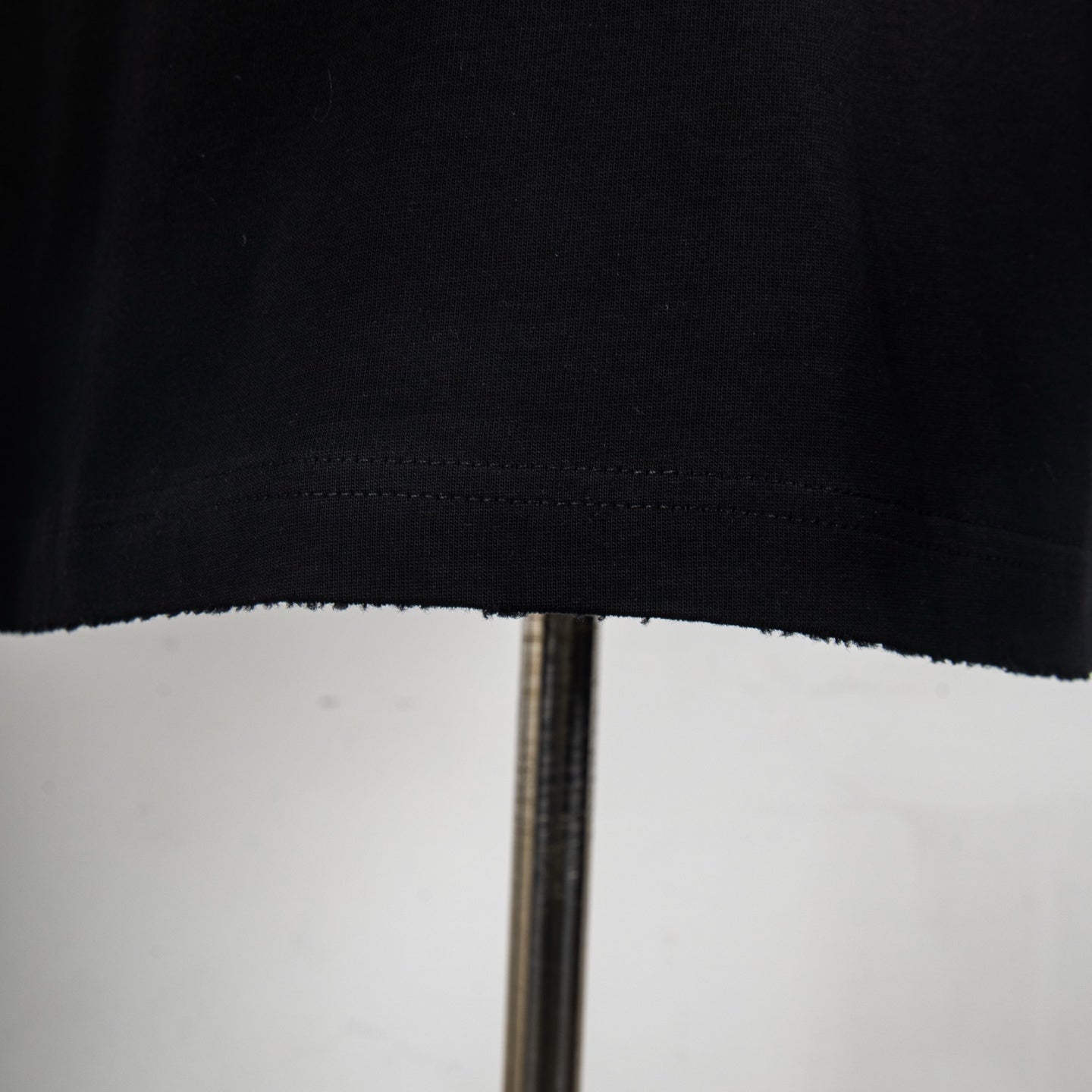 Black T-shirt with stitched hem edge