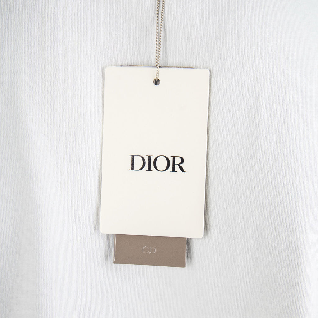 White fabric garment tag reading DIOR