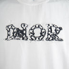 White T-shirt chest graphic with DIOR lettering in black