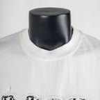 White T-shirt neckline close-up with black logo detail