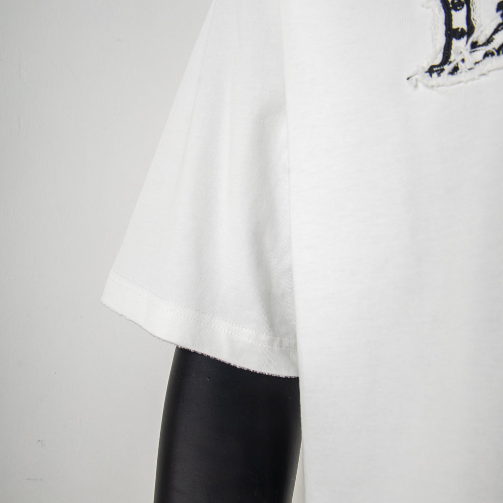 White T-shirt sleeve and side drape