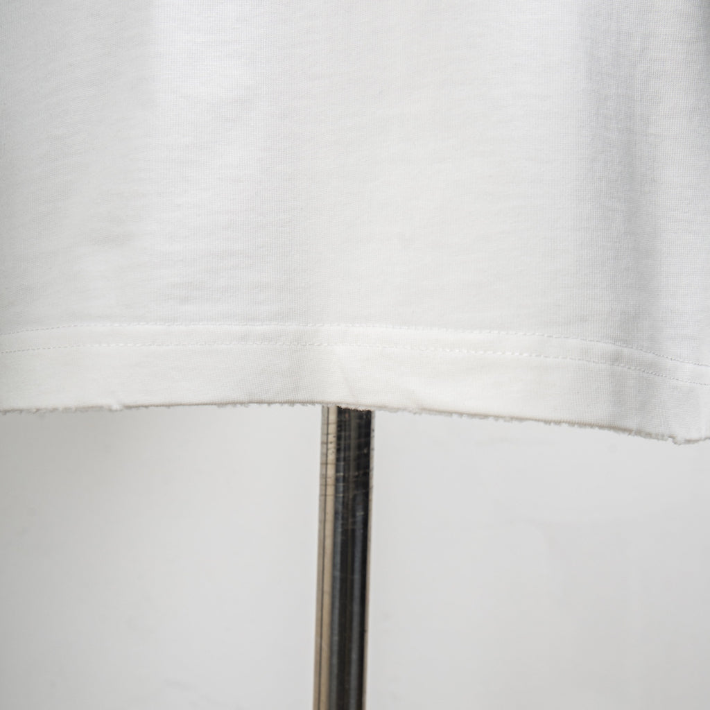 White T-shirt hem with stitched edge
