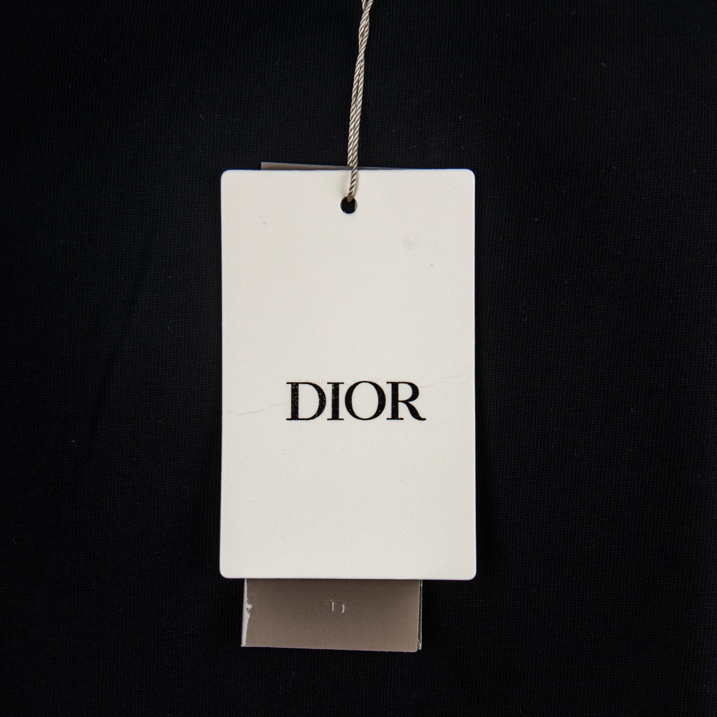 Black T-shirt with hanging Dior tag