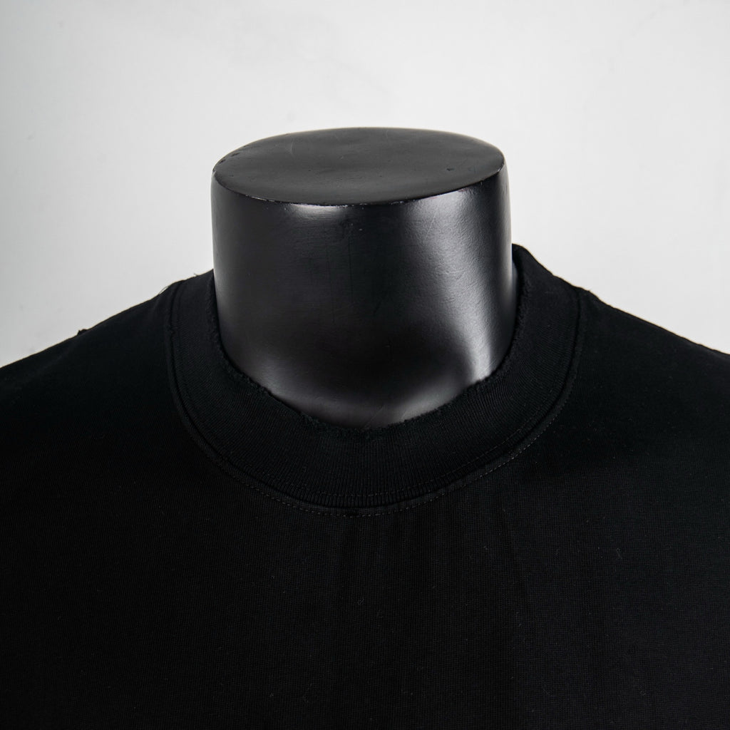 Black crewneck T-shirt neckline close-up