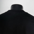 Black crewneck T-shirt back collar area close-up
