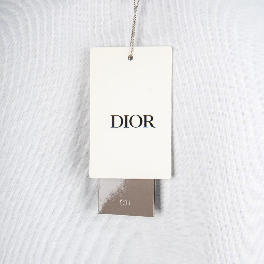 White Dior T-shirt with hanging DIOR brand tag