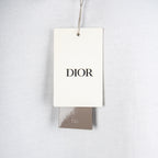 White Dior T-shirt with hanging DIOR brand tag
