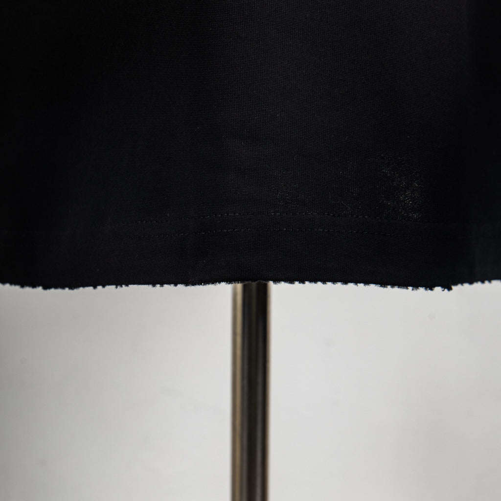 Black T-shirt hem with stitched edge