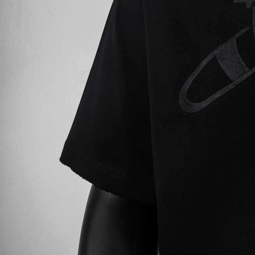 Black short-sleeve T-shirt with partial logo on side panel