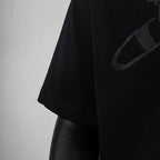 Black short-sleeve T-shirt with partial logo on side panel