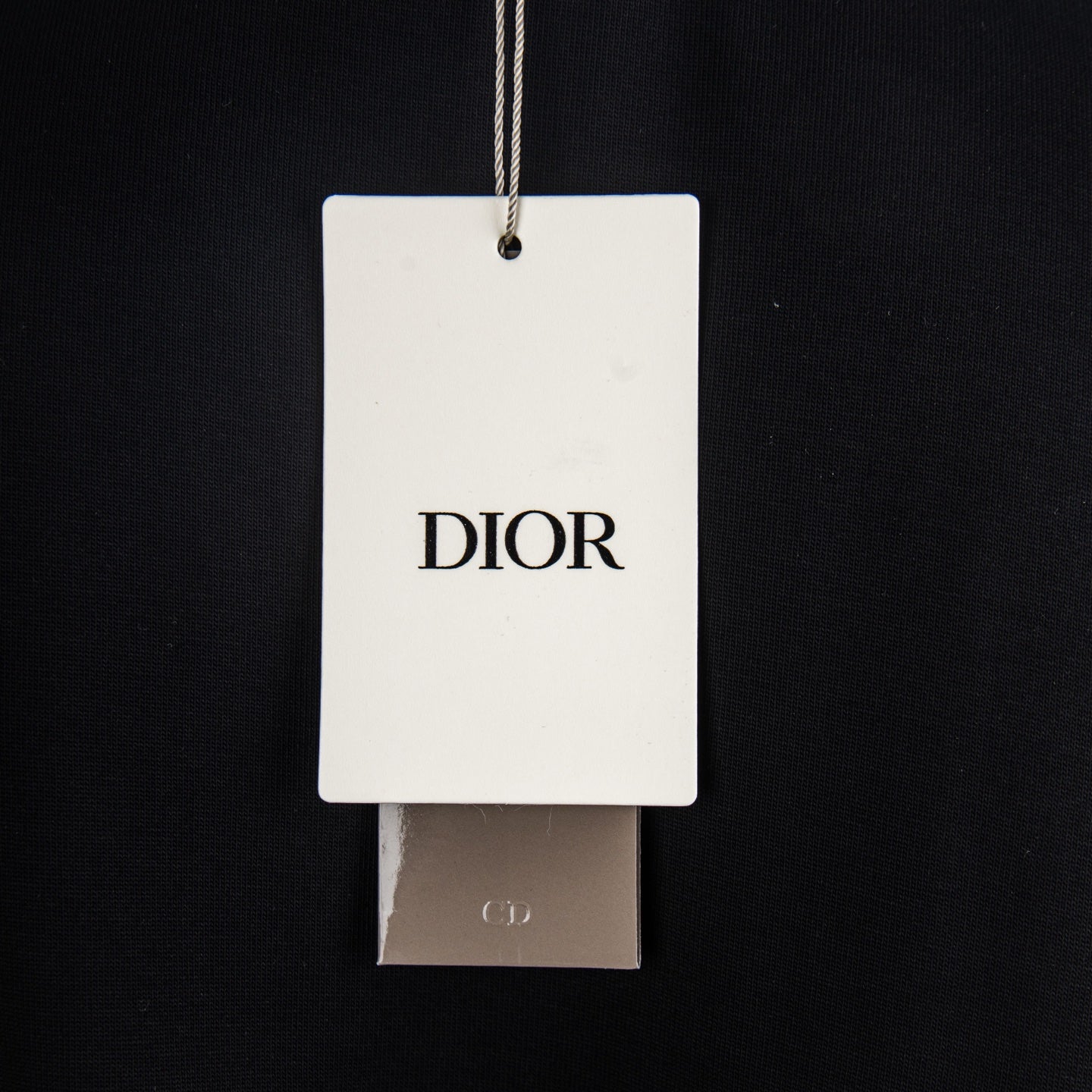 Dior hang tag on black short-sleeve T-shirt