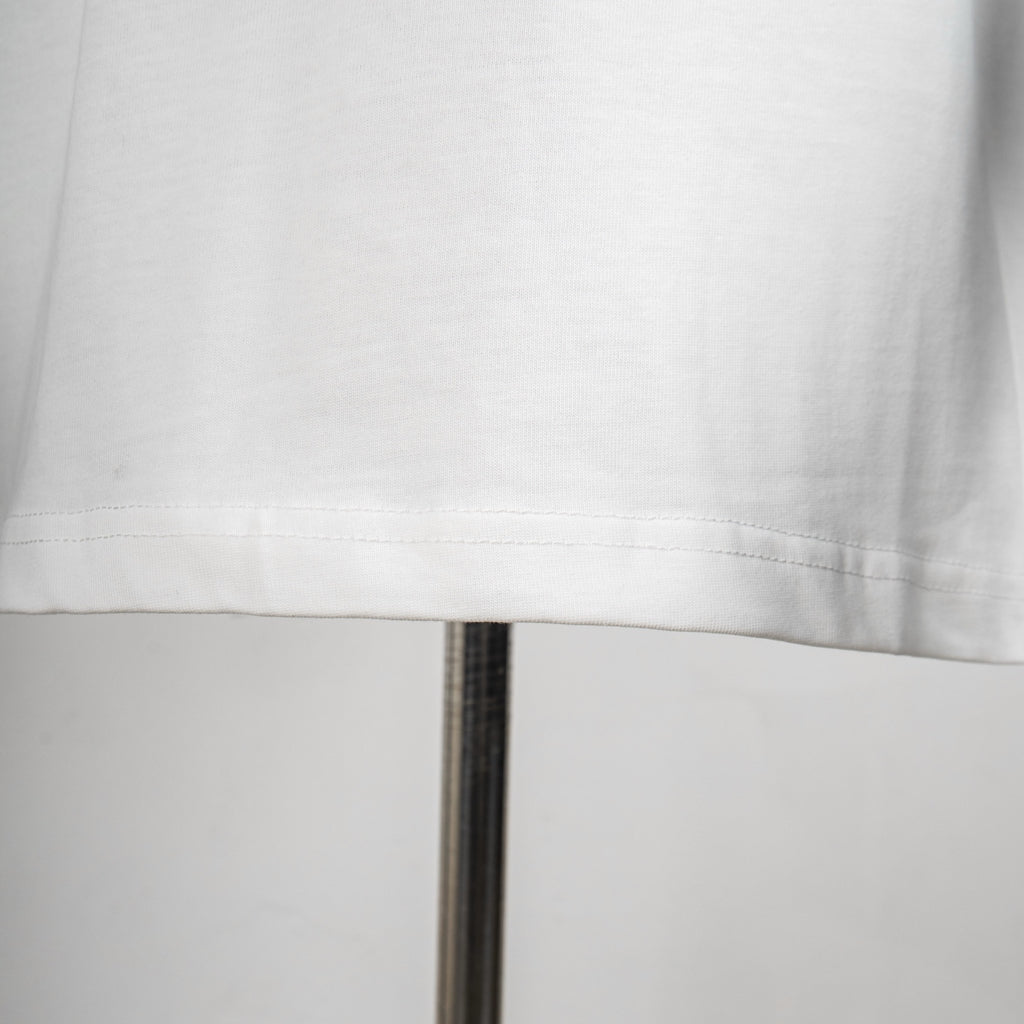 White Dior T-shirt hem with visible stitching