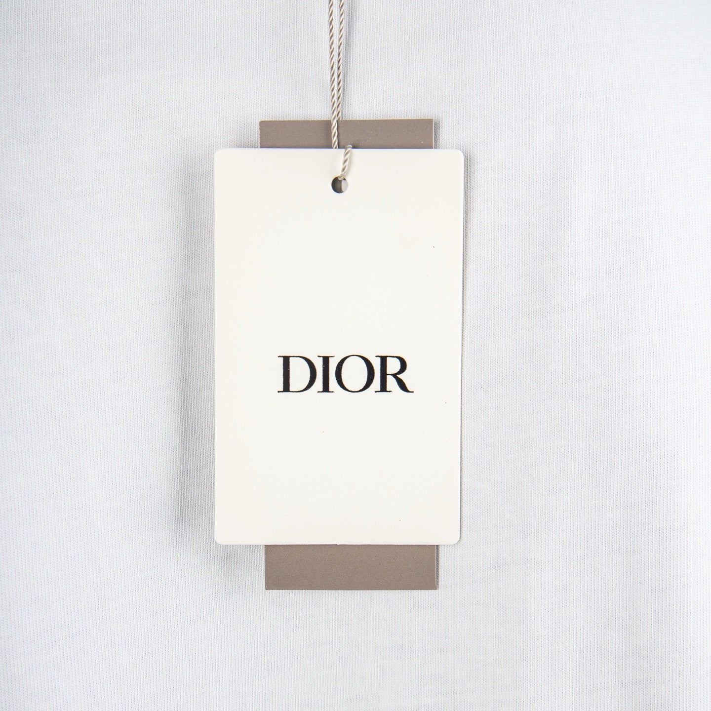 White T-shirt with hanging DIOR brand tag