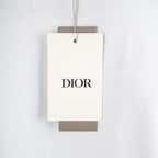 White fabric tag with DIOR logo for Dior T-shirt