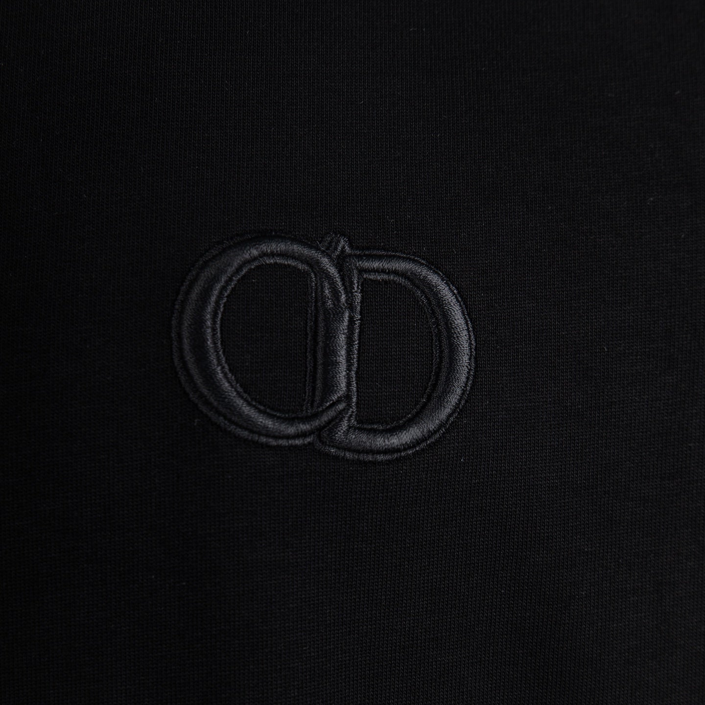 Dior monogram emblem on black T-shirt chest