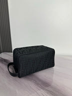 Fendi dark crossbody bag with FF logo pattern and top zip, angled view