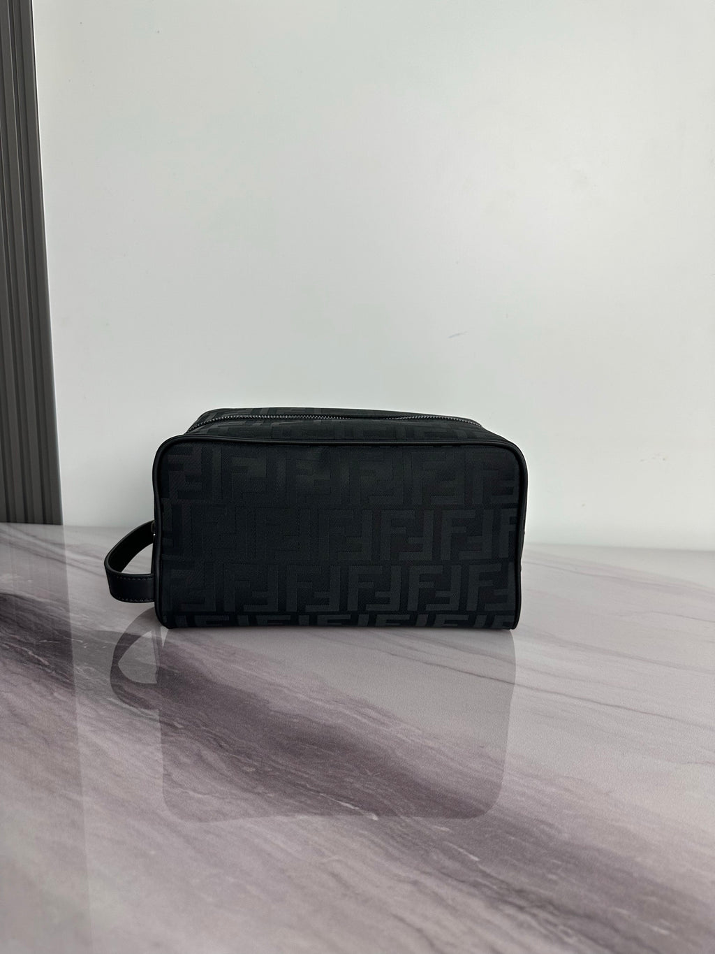 Fendi dark crossbody bag with FF logo pattern and top zip, front view