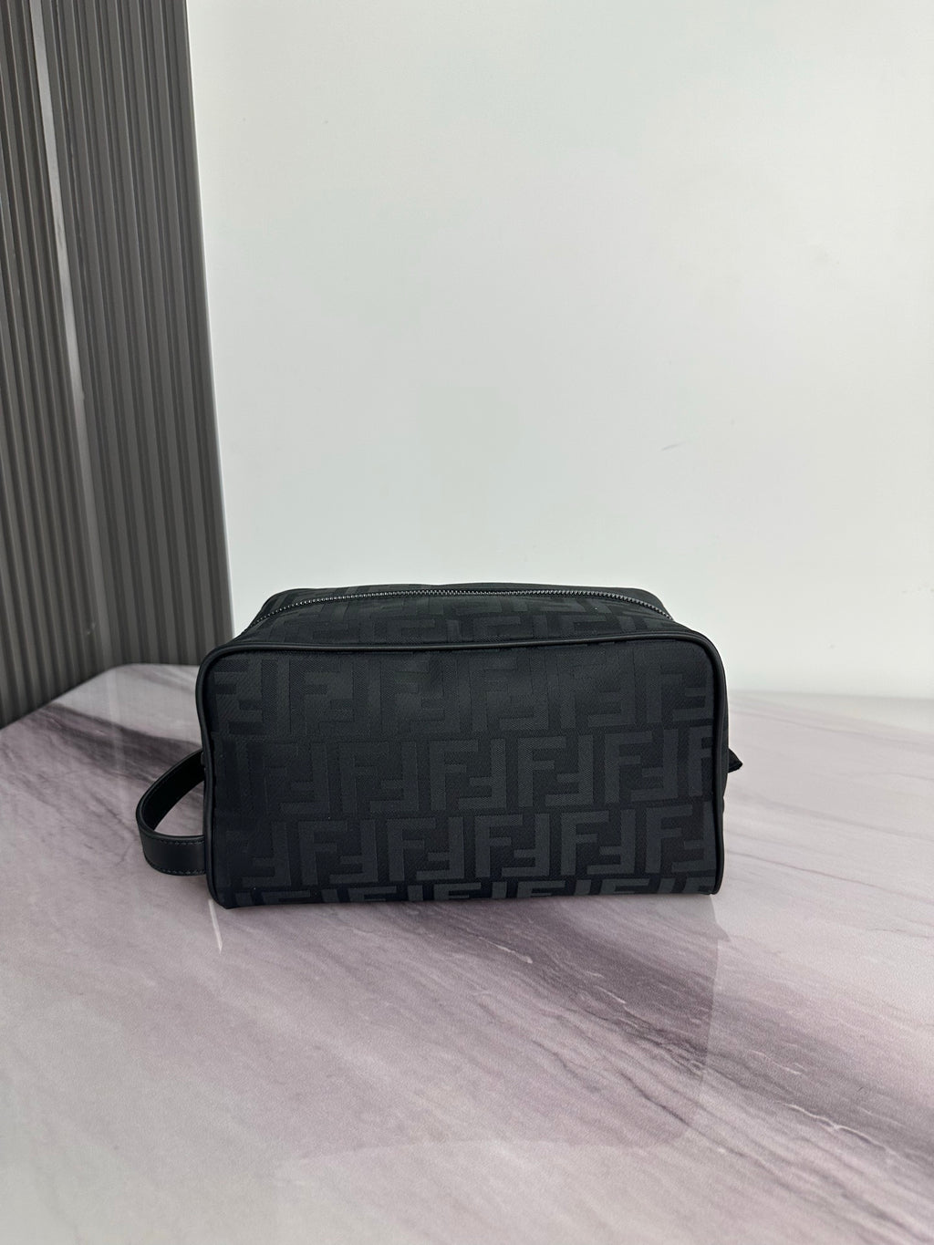 Fendi dark FF-logo crossbody bag with top zip and shoulder strap, centered view