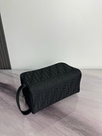 Fendi dark crossbody bag with FF logo pattern and shoulder strap, side view