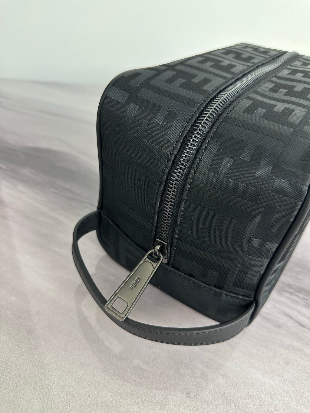 Fendi dark FF-logo crossbody bag with textured finish and silver zipper pull