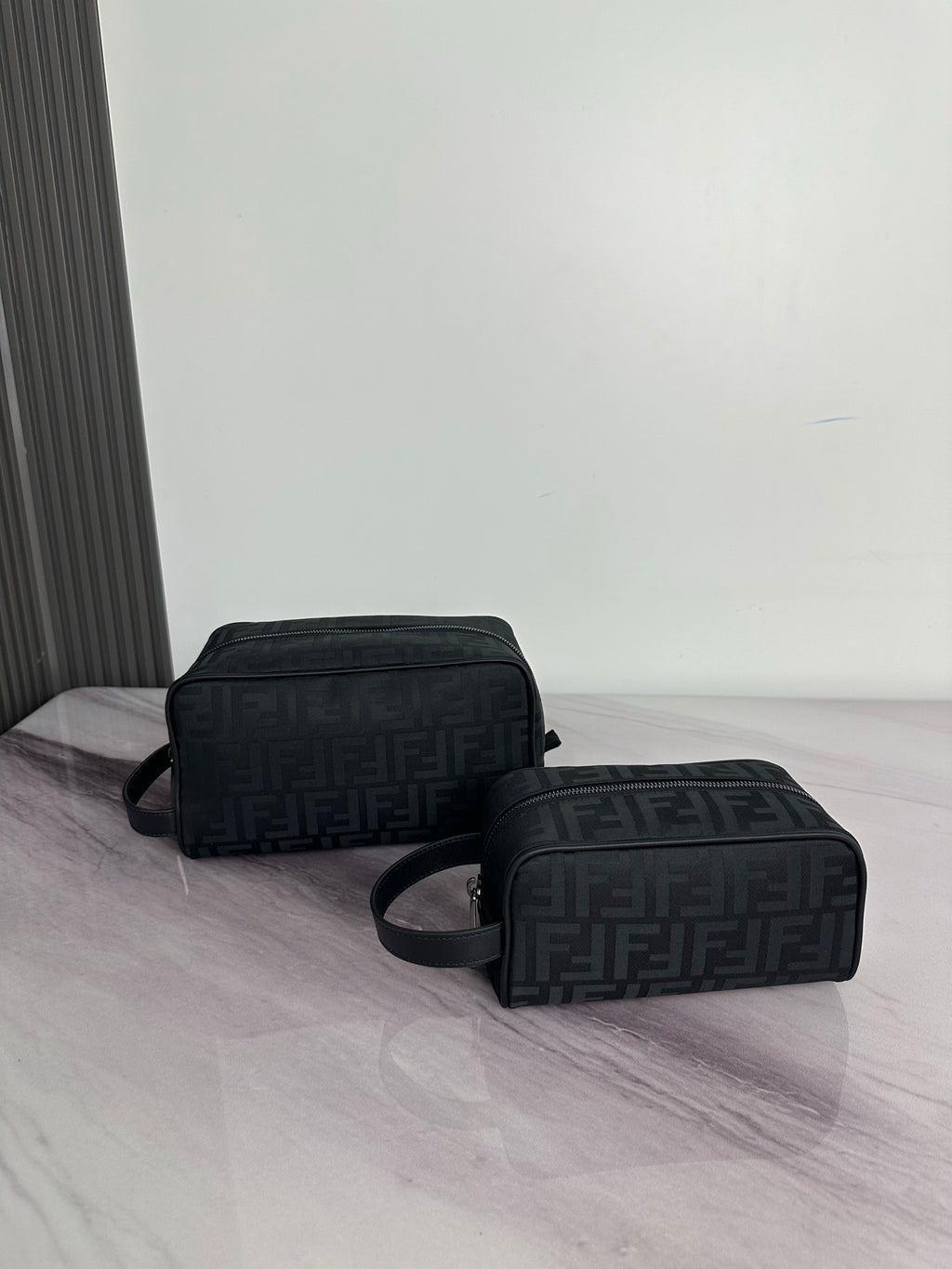 Fendi crossbody bag with dark monogram pattern, dual compartments, zip closure