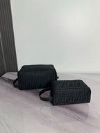 Fendi crossbody bag with dark monogram pattern, dual compartments, zip closure