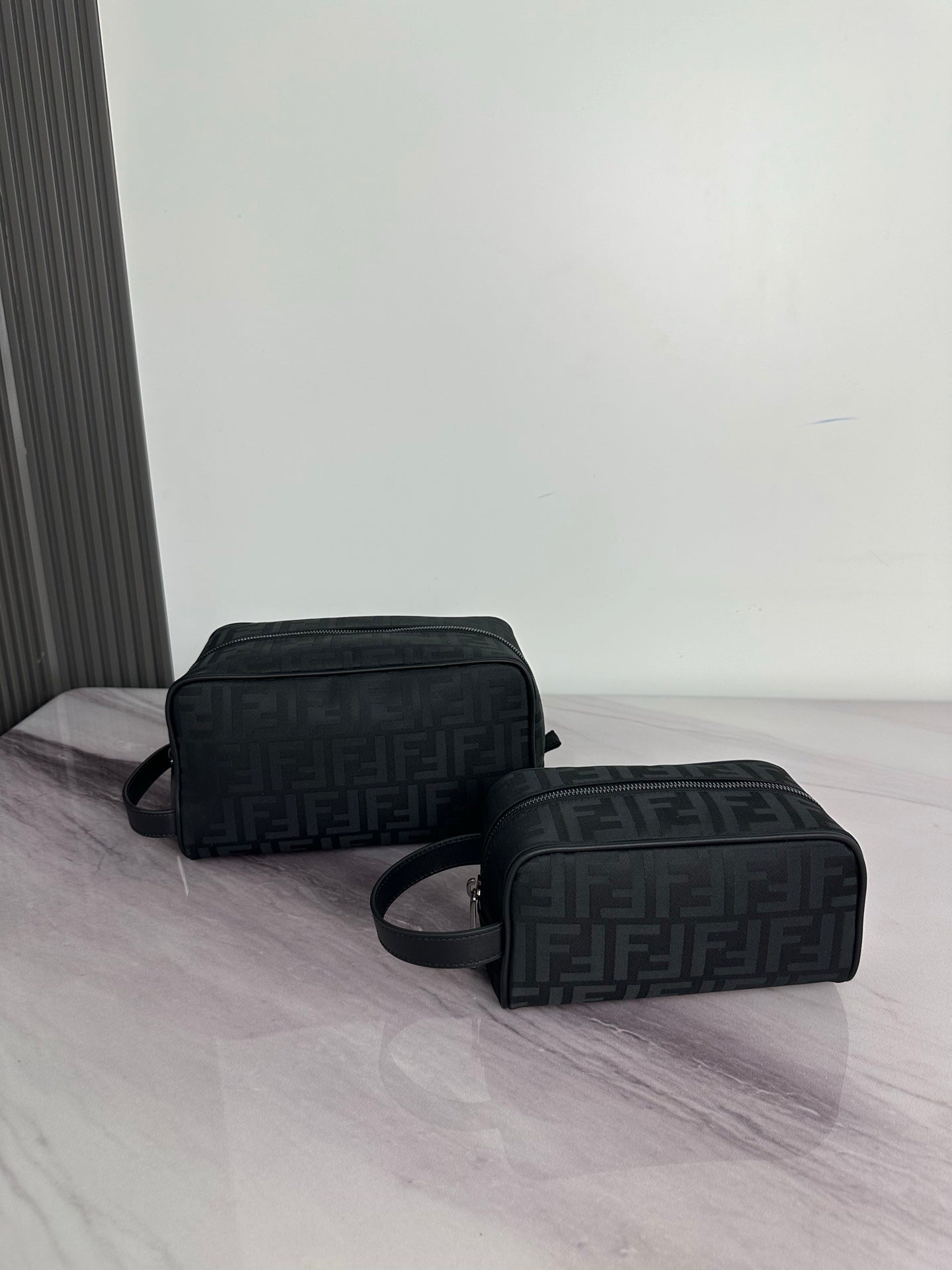 Fendi crossbody bag with dark monogram pattern, dual compartments, zip closure