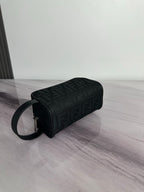 Fendi crossbody bag with dark monogram fabric, cylindrical profile, zip top, strap