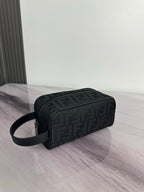 Fendi crossbody bag with dark monogram pattern, rounded shape, zip top and strap