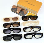 Louis Vuitton sunglasses set with multiple frames: black, cream, and beige with tinted lenses.