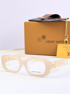 Louis Vuitton sunglasses, light frames with clear gray-tinted lenses and gold logo detail.