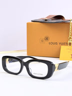 Louis Vuitton sunglasses with black frames and light gray-tinted lenses, gold logo on temple.
