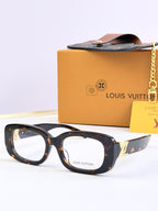 Louis Vuitton sunglasses with dark tortoise-effect frames and clear gray-tinted lenses.