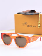 Louis Vuitton orange sunglasses with dark lenses and LV side logo