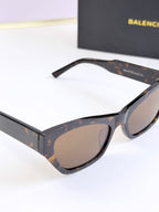 Balenciaga sunglasses, tortoiseshell frame with tan tinted lenses