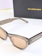 Balenciaga sunglasses, clear frame with light lenses, side view