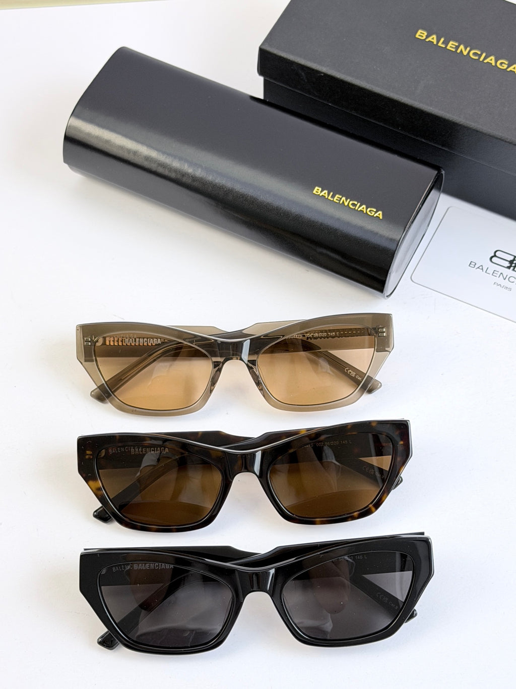 Balenciaga sunglasses set of three: tan, tortoiseshell, and black frames