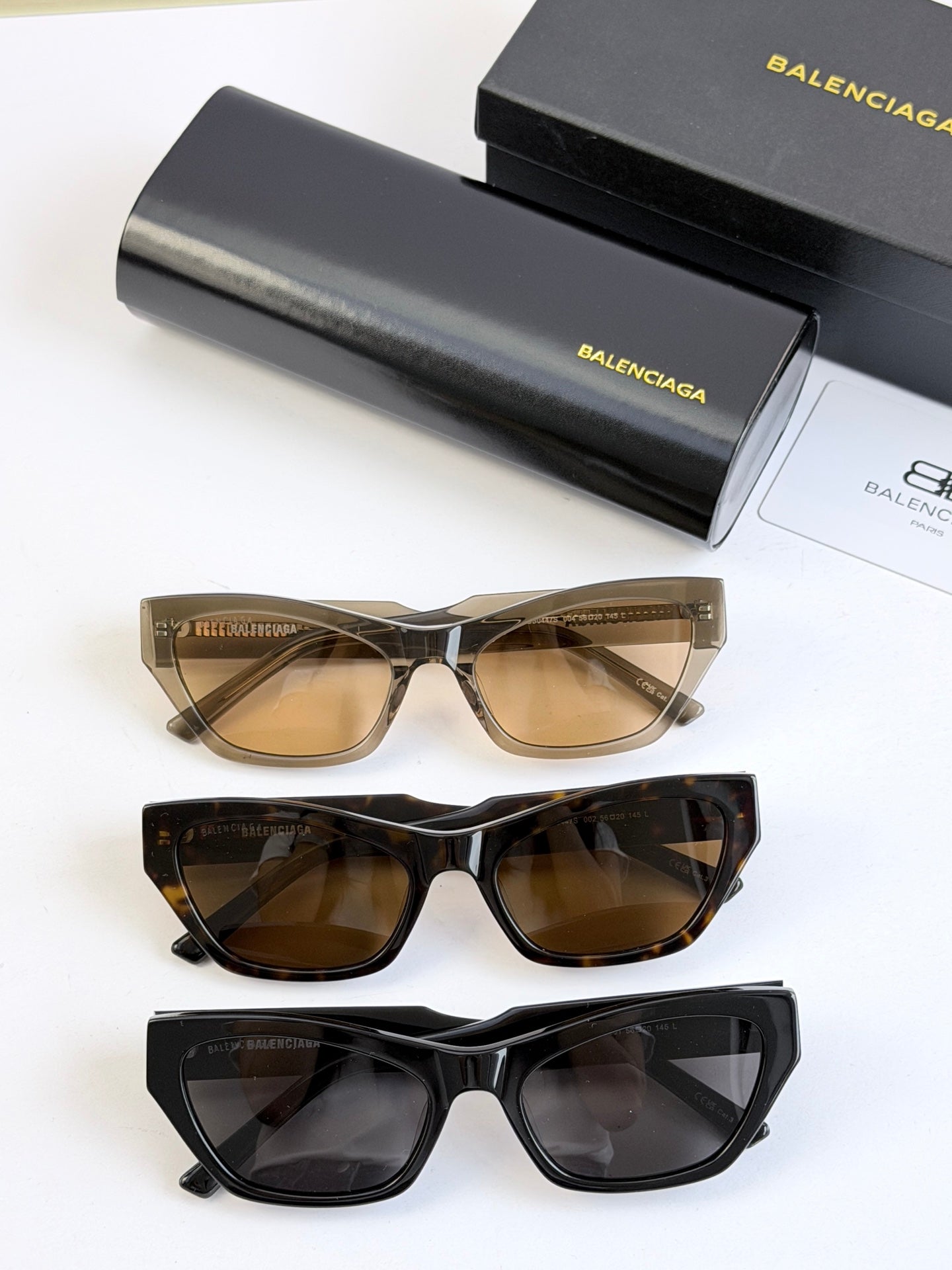 Balenciaga sunglasses set of three: tan, tortoiseshell, and black frames